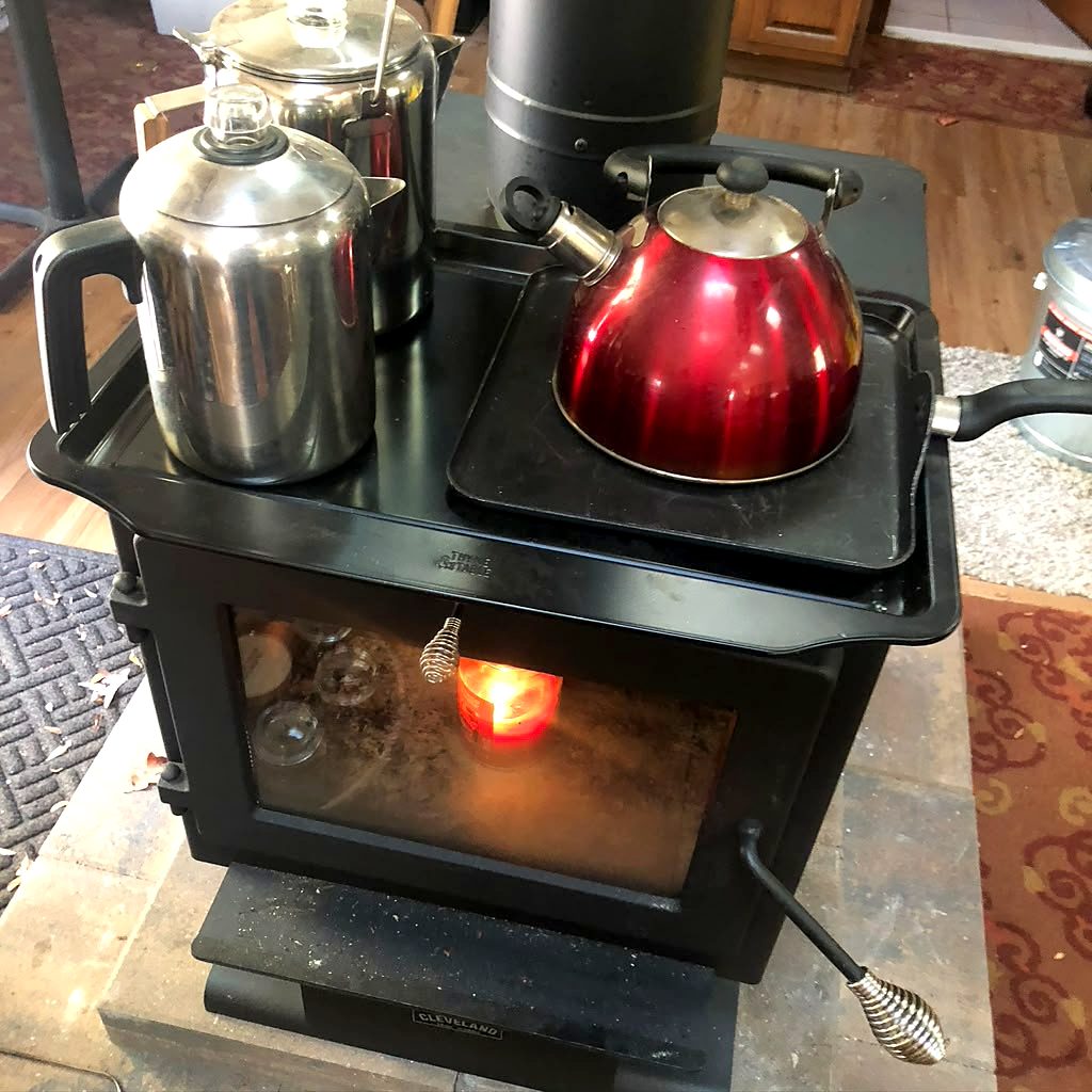 Kettles warming on the lounge wood stove